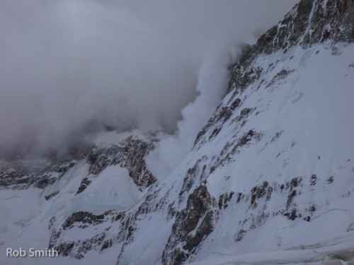 An avalanche coming down out of the clouds, on the main summit of Cerro San Lorenzo.
